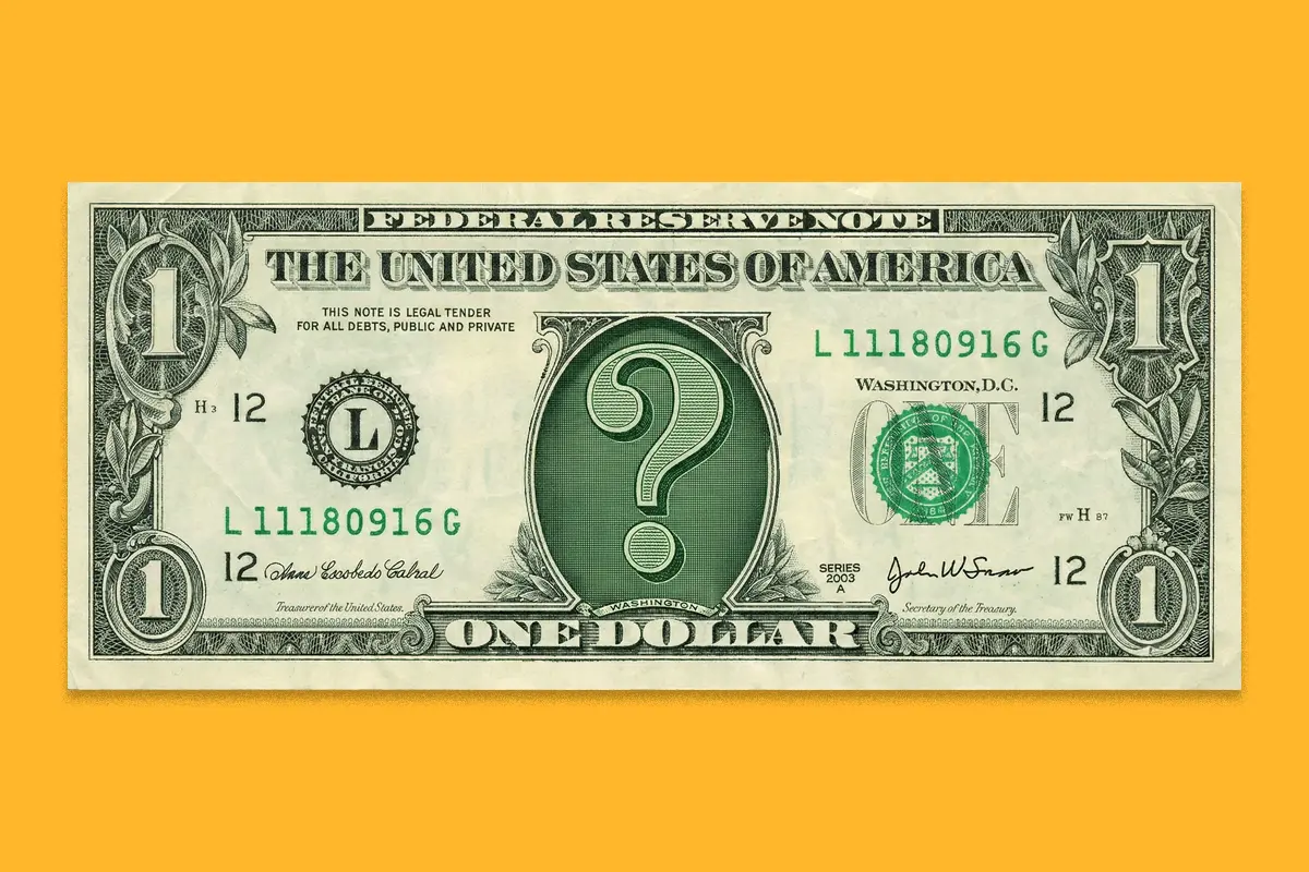 Un billete de un dolar con un signo de interrogación en el centro